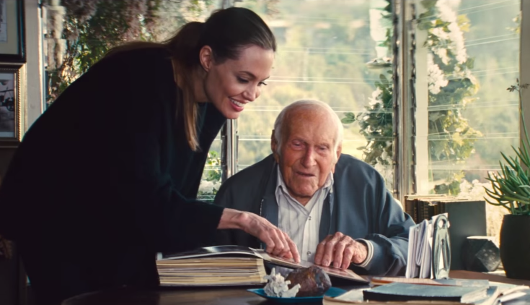 Watch Angelina Jolie Charms Louis Zamperini in ‘Unbroken’ Featurette